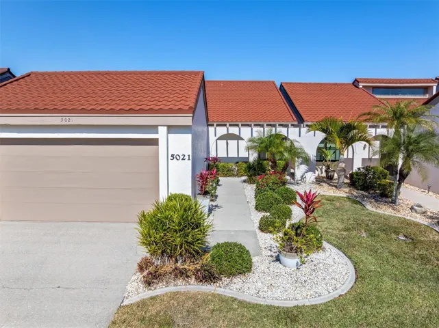 2 car garage and walkway to entrance