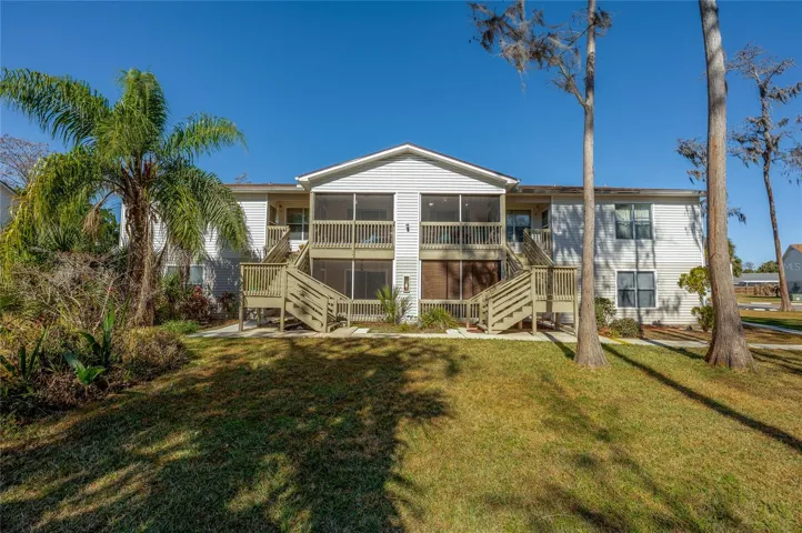 Well-maintained residential building set amid mature landscaping and open green space, offering a welcoming and established community setting.