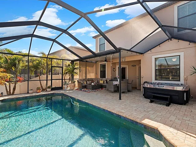 Covered Lanai overlooking pool and pond
