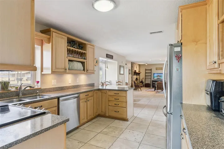 Kitchen Overlooks Dining and Living Room