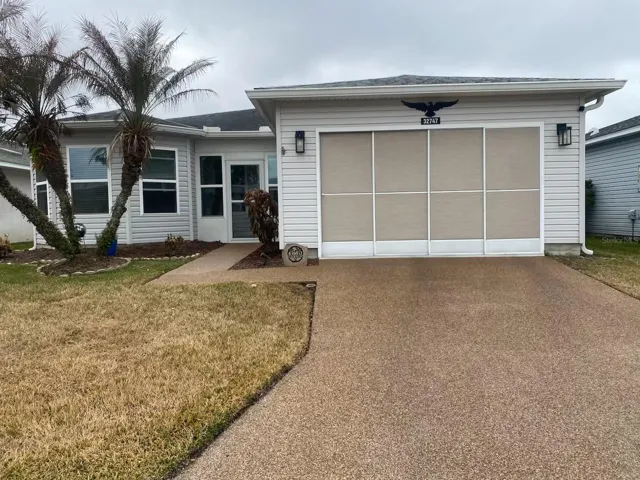 UPGRADED DRIVEWAY AND SIDEWALK LEADING TO YOUR FRONT DOOR