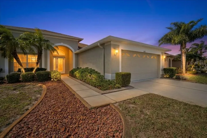 Extended front yard with golf course views