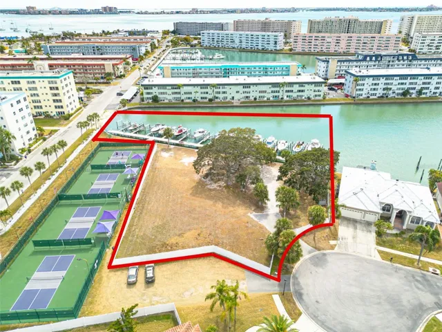 Situated near pickleball courts in the Skimmer Bay Subdivision of the Pasadena Yacht & Country Club