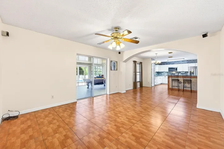 Family room is open to a breakfast nook and the kitchen beyond.