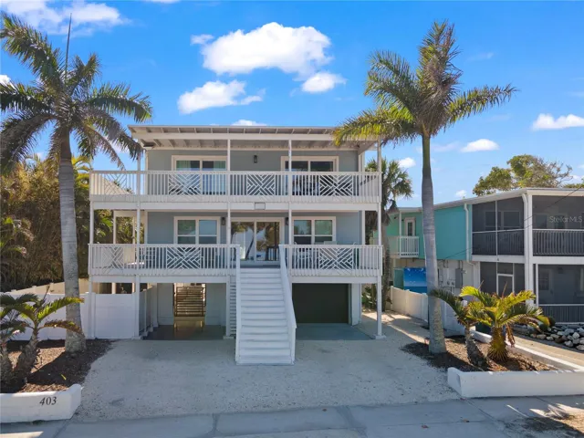 FRONT VIEW WITH POOL AREA ENTRANCE & GARAGE