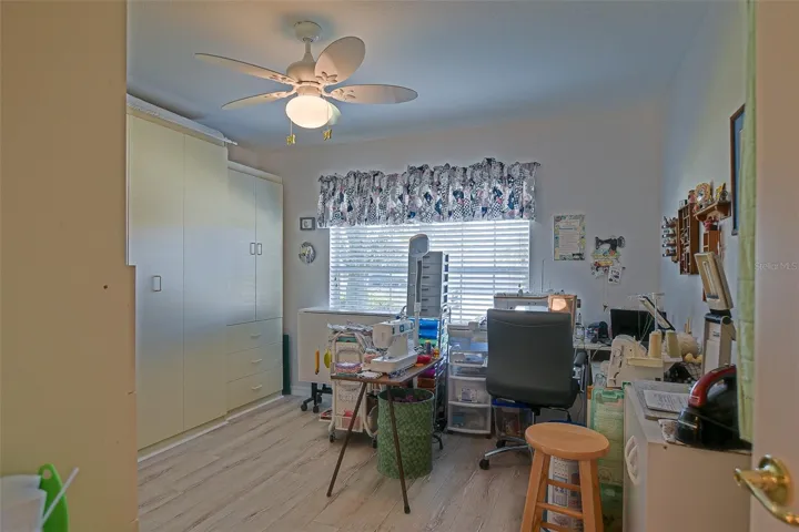 Guest bedroom with wall bed and storage