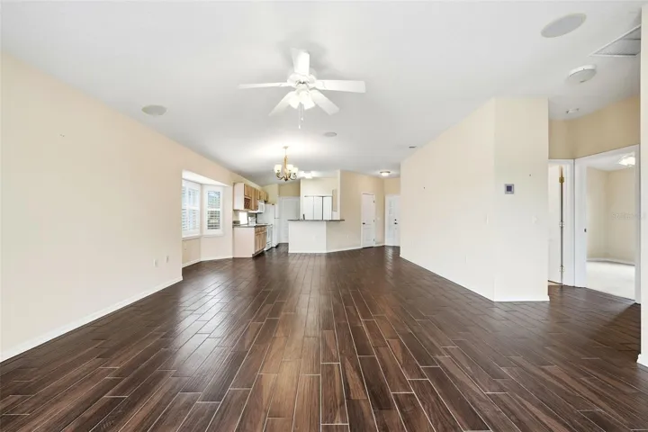View from lanai into great room, dining, kitchen areas and hallway to Bedroom 2 and Guest Bath!