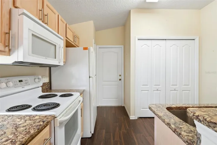 Kitchen has pantry closet and closet for washer/dryer...included!