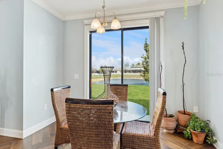 Dining, with views to backyard and pond