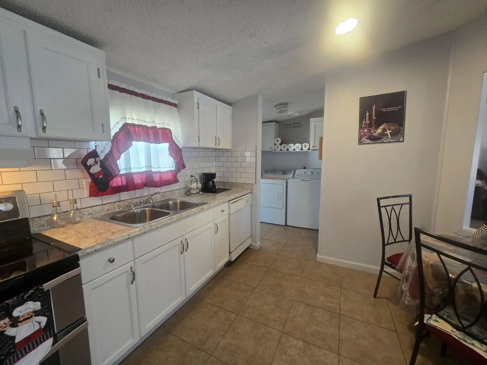 Kitchen to the right the laundry room