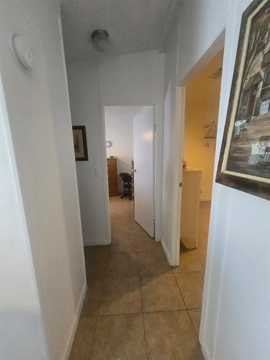 hallway towards 2nd bathroom and 2 bedrooms