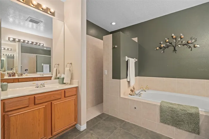 Primary En-Suite with a Garden Tub, Walk-in Shower and a Water Closet