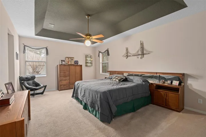 Primary Suite with a Tray Ceiling and French Doors to the Lanai
