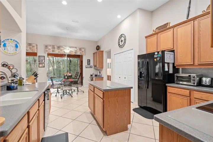 Kitchen with a view of the Dinette and Pool