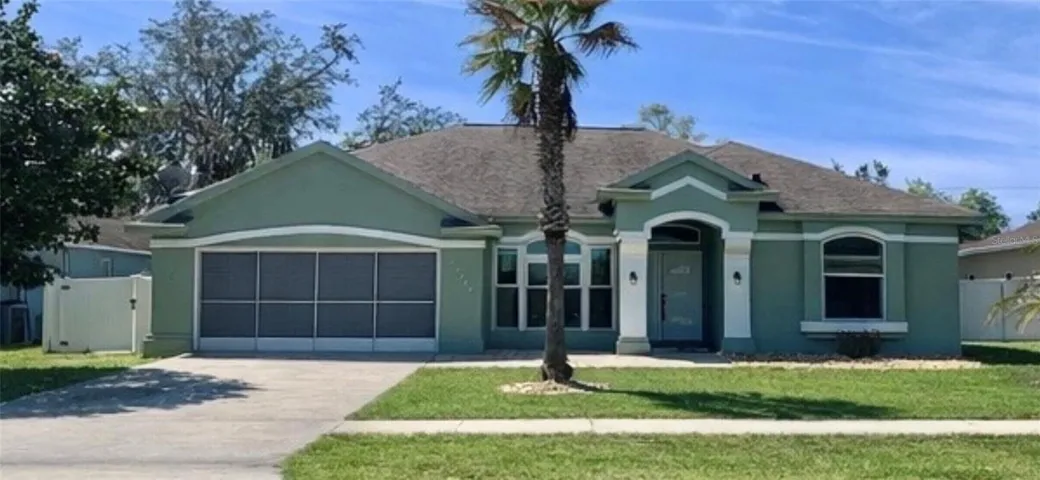 Professionally remodeled executive 4/2/2gar Heated pool home.