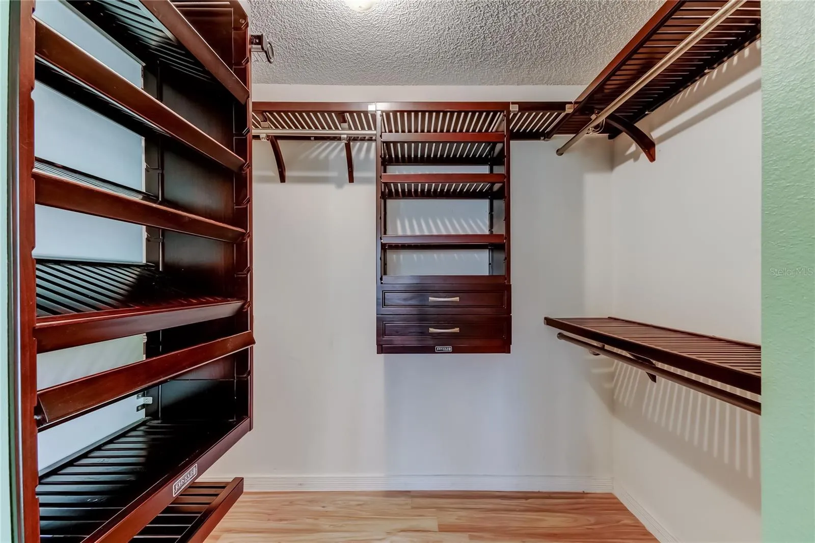 Primary Bedroom - Custom wood closet organizer