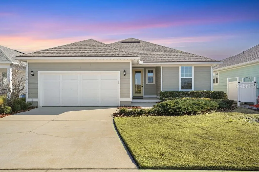 REAR OF HOME AND DRIVEWAY