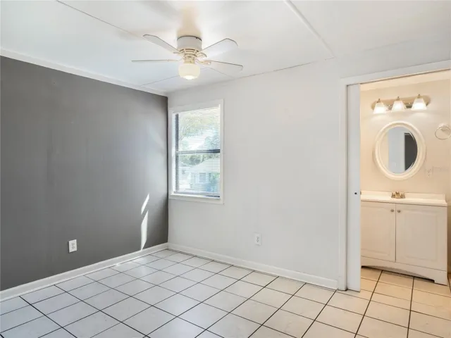 Primary bedroom with ensuite half bath