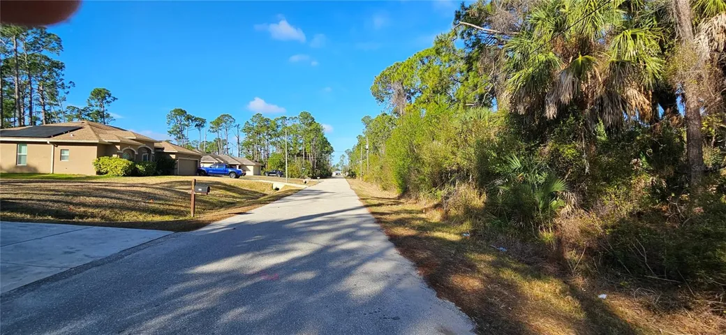 2 vacant lots around new construction