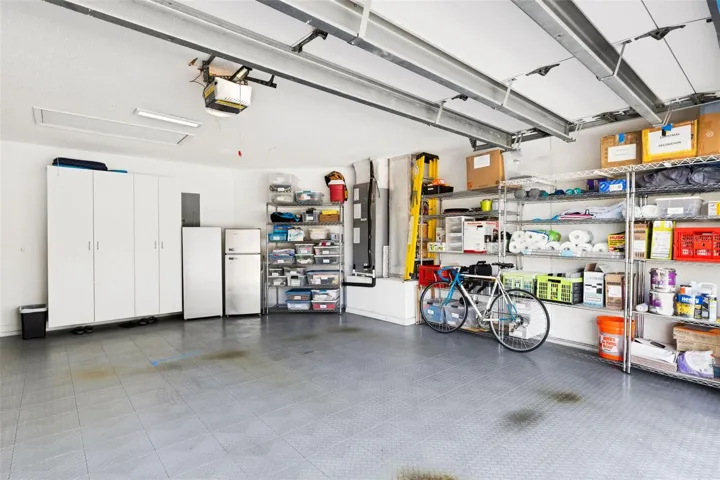 Garage will include all storage racks, mini fridge and standing freezer, cabinets, plus overhead storage.