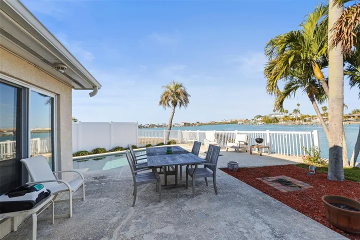 POOL AND PATIO OVERLOOK BEAUTIFUL WATER VIEWS