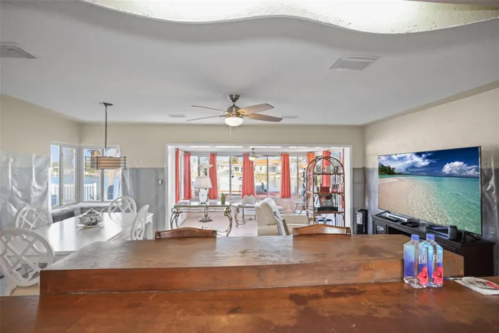 VIEW OF LIVING, DINING AND SUNROOM