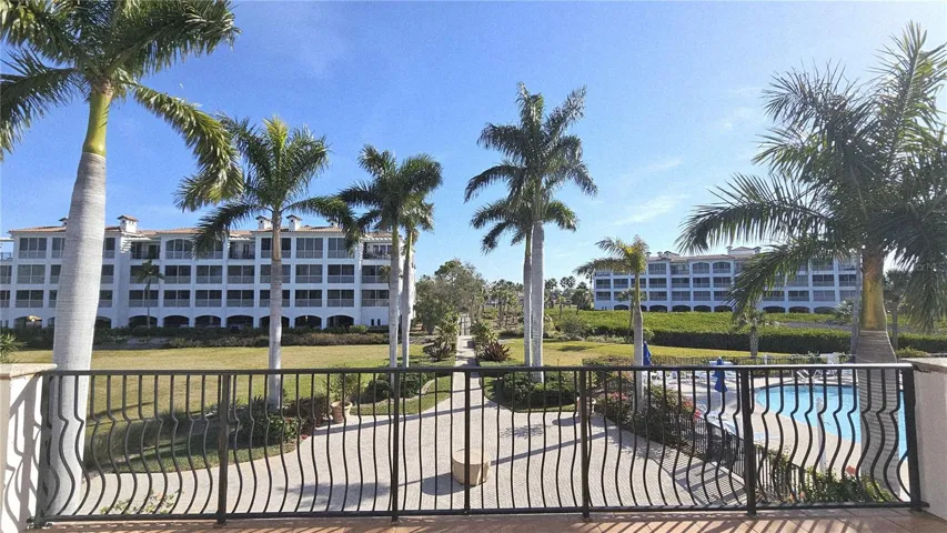 View of large heated pool + spa