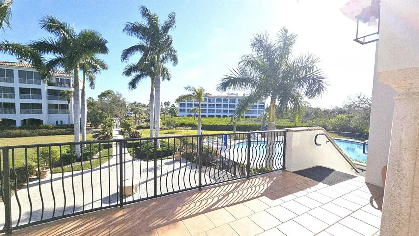 View of large heated pool + spa