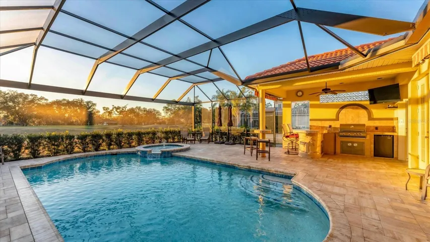 This is Florida lifestyle! Generous entertaining and lounging areas.  Retractable lanai shades offer added shade when desired.