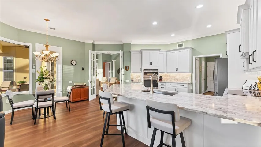 Remodeled kitchen with one level countertops.