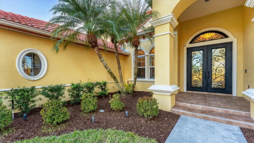 Stately double front doors featuring hurricane impact resistant for peace-of-mind
