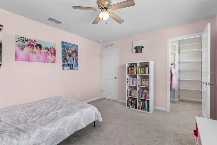 Bedroom 3 features a walk in closet with custom Elfa components