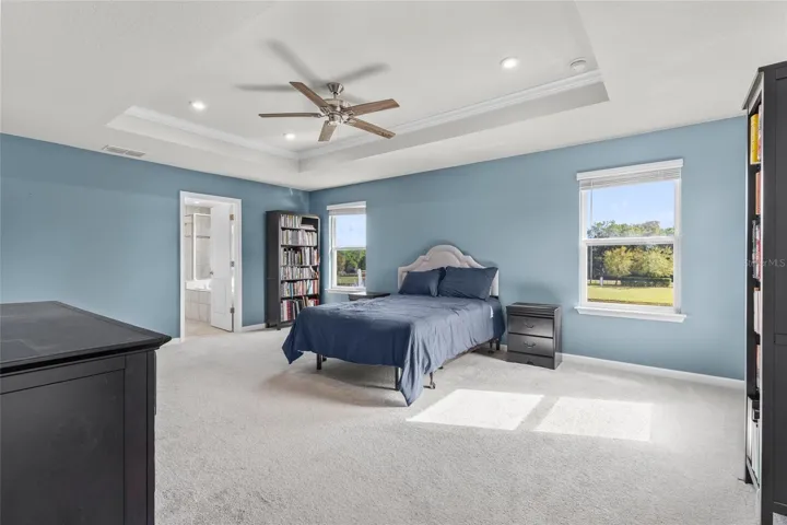 Primary bedroom with views to pond