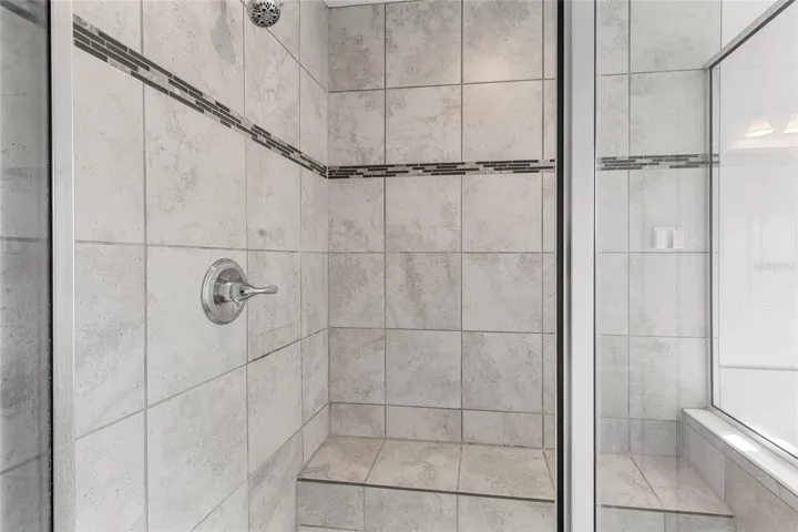 Shower stall features seat