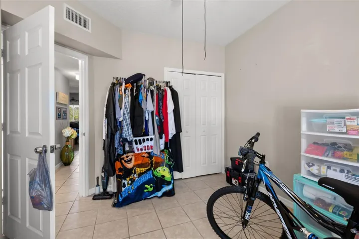 Bedroom 3 highlighting closet storage and convenient access to the hallway. The functional layout and clean finishes provide a comfortable secondary living space within the thoughtfully designed floor plan.