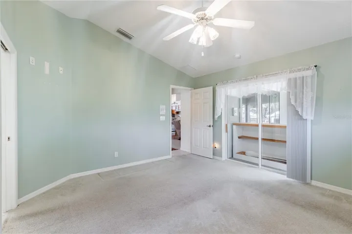 Primary bedroom with slider to Florida Room