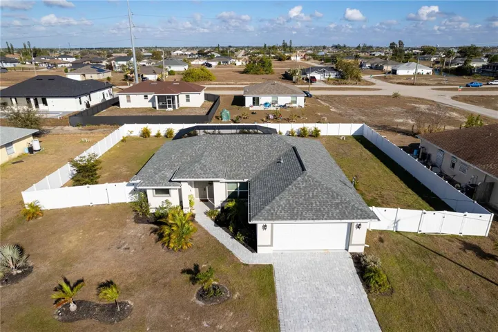 Experience ULTIMATE SWFL LIFESTYLE in this BEAUTIFUL 2023-built POOL HOME set on RARE 0.34-acre FENCED HOMESITE w/ 120 ft frontage & 125 ft depth in desirable NW Cape Coral.