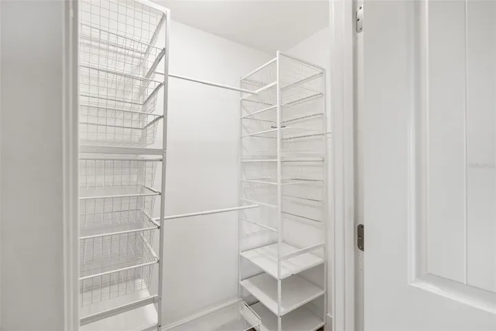Walk-in closet in primary bedroom