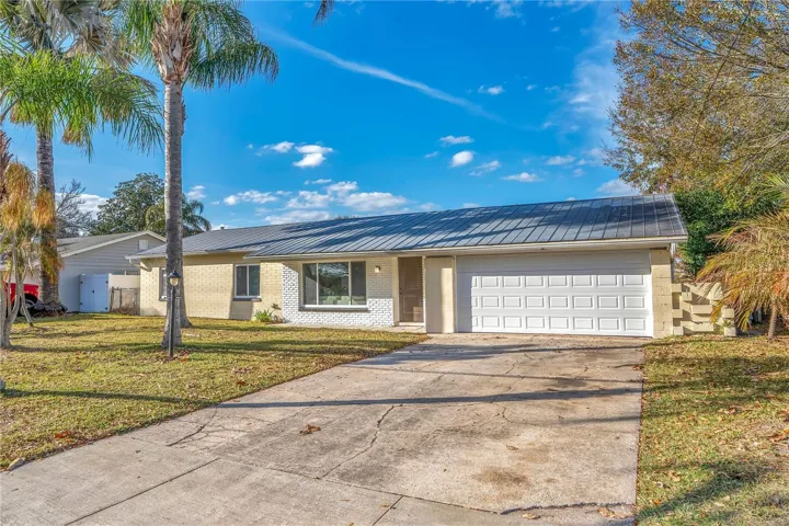 Front: Metal Roof, 2 car garage