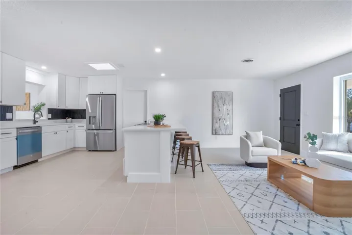 Brand New Kitchen: Stainless Steel Appliances, Snackbar, Slow Close Cabinets, Copper Sink, Quartz Counters, Separate Cabinets for Coffee/Wine Bar. Open to Living Room.