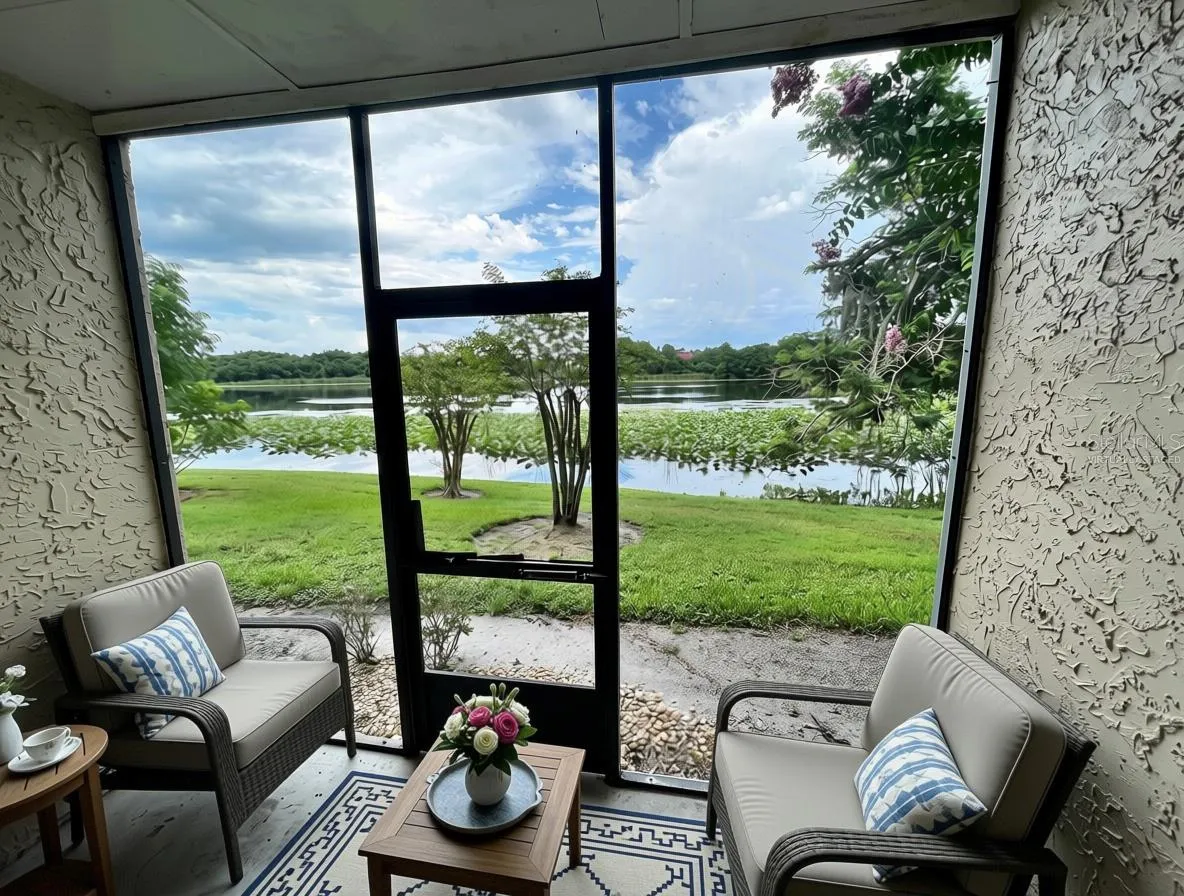 Virtually staged screened-in back porch with soothing water views to Lake Pearl