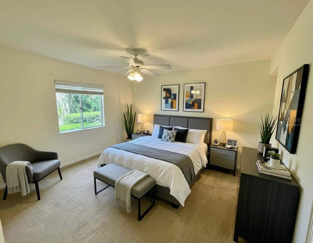 Virtually staged primary suite with en suite bathoom and walk-in closet.. Lake views!