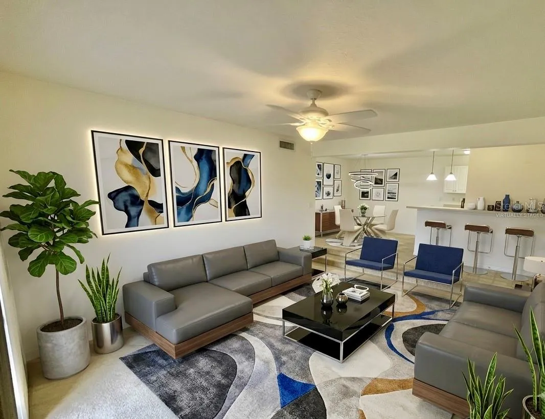 Virtually staged living room with views to lake.