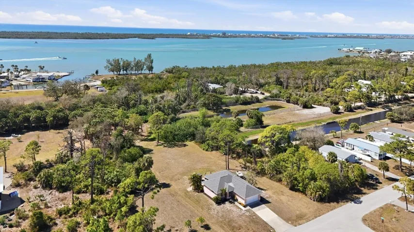 Two car garage home on .80 acres (3000 plus 2998 Bourbon).  Walking distance or golf cart ride to the Lighthouse Grill and Marina!