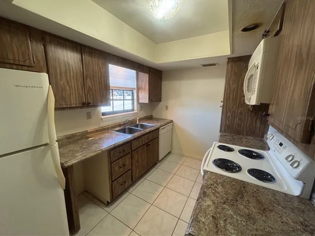 Kitchen includes Dishwasher, Refrigerator and microwave