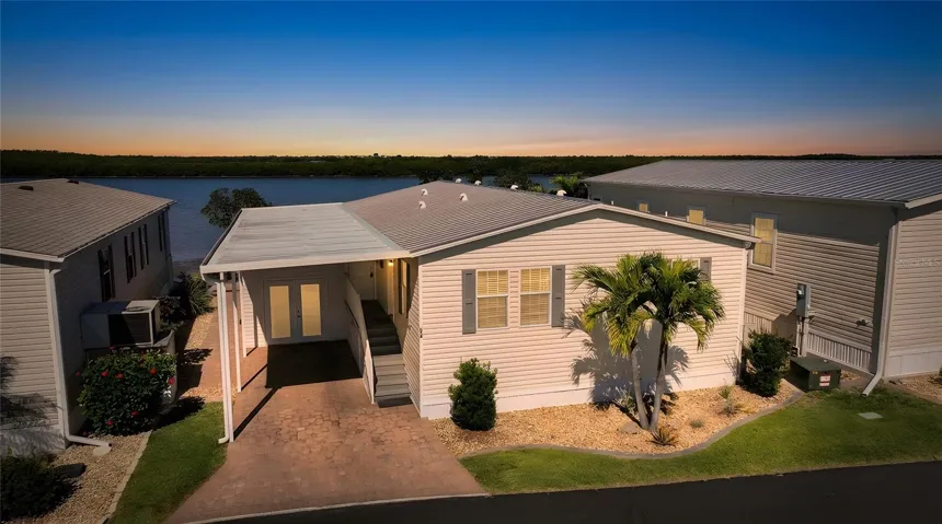 Direct Riverfront Home - Sunset altered by photographer