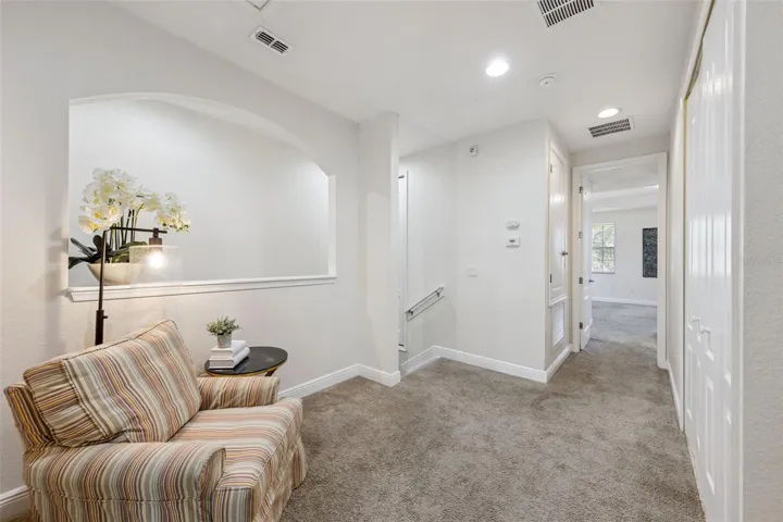 Landing at the top of the stairs with room for seating or small desk