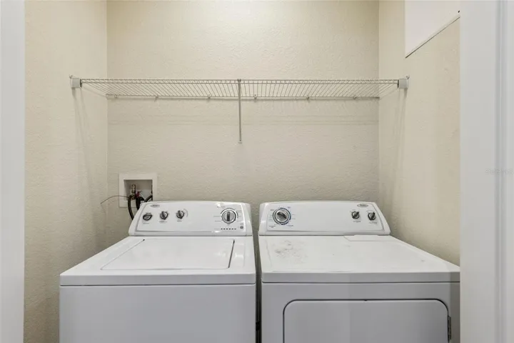 Upstairs laundry closet.  Washer/dryer convey