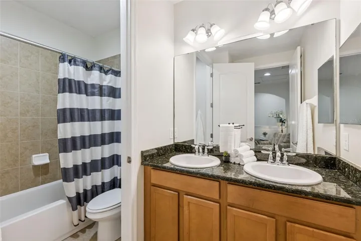 Bathroom 2 has double sinks and granite counters