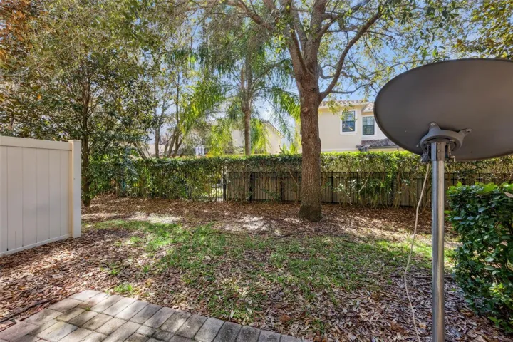 Semi-private backyard with paved patio